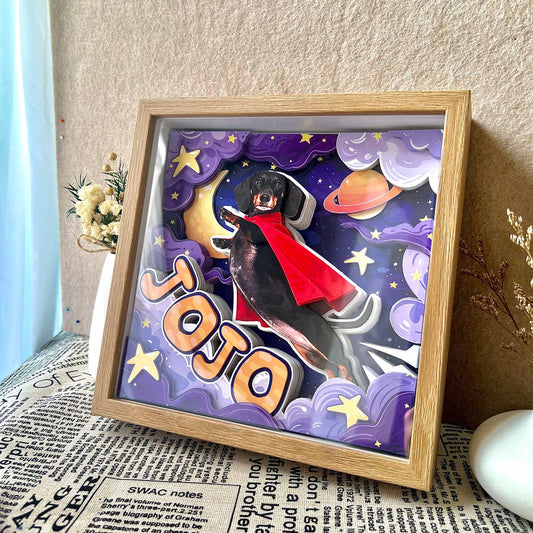 Custom 3D dachshund portrait shadow box displayed at an angle on a table with dried flowers.