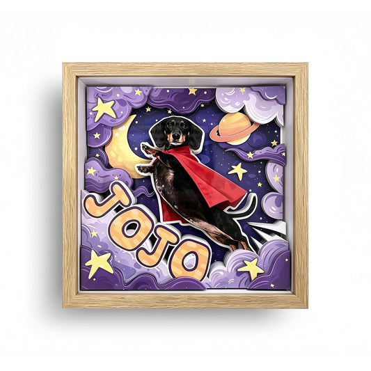 Front view of a custom 3D dachshund portrait shadow box with a space theme and red cape.